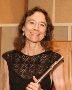 Mariana Smith smiling while holding flute