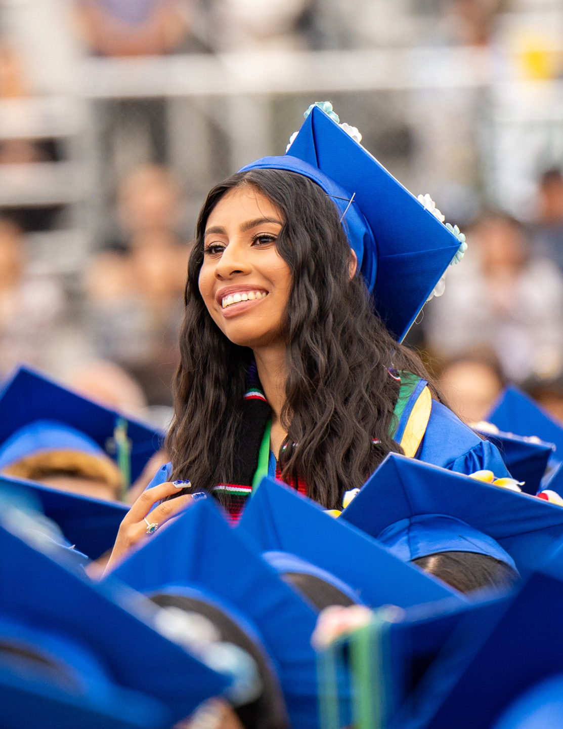 Class of 2023 Female Graduate Standing Up