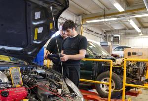 Oxnard College automotive student learning hands on skills.