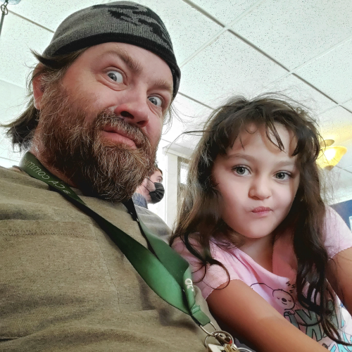 Jeremy Hanes with his daughter, Luna, making silly faces at the camera