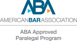 ABA logo in blue font with text below stating American Bar Association and line below. ABA Approved Paralegal Program. Image is the ABA logo