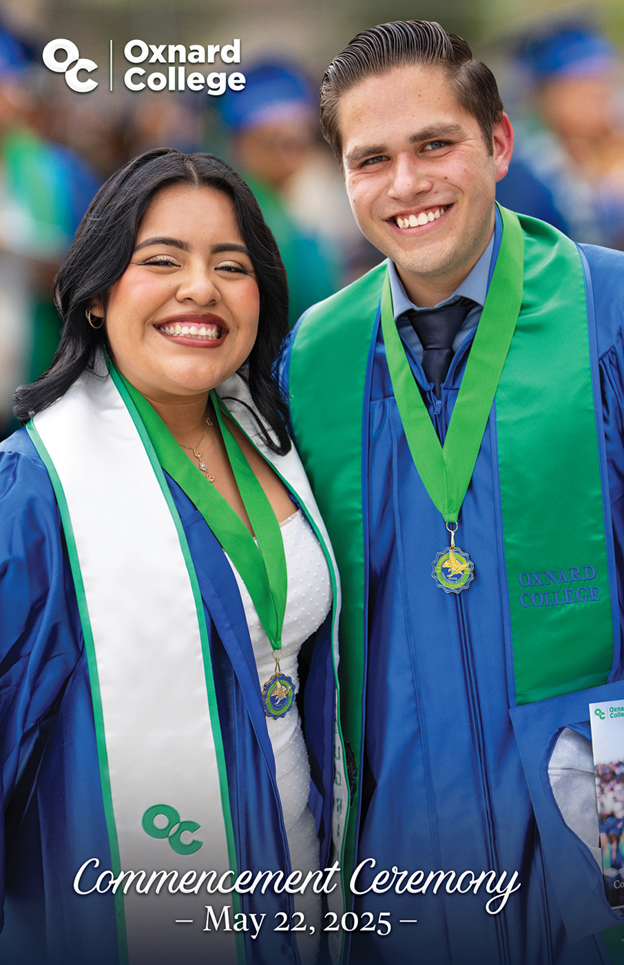 Commencement program cover of two student graduates.