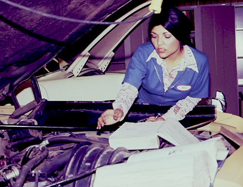 Oxnard College Retro Photo Female Student working on Auto