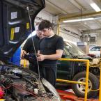 Oxnard College automotive student learning hands on skills.