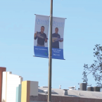 Light pole banners on Oxnard Boulevard in Oxnard featuring two Oxnard College graduates.