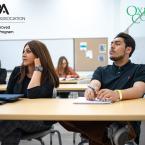 Photo of students sitting in class listening to a lecture and taking notes. Text reads "ABA American Bar Association, ABA Approved Paralegal Program; Oxnard College"
