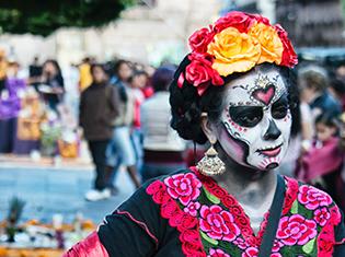 woman's face painted for dia de los muertos celebration