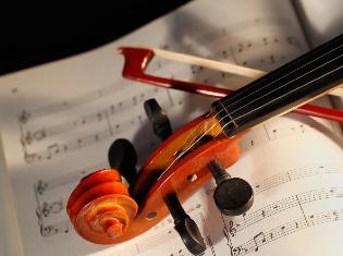 violin sitting on sheet music