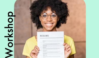 African-American female smiling and holding printed resume