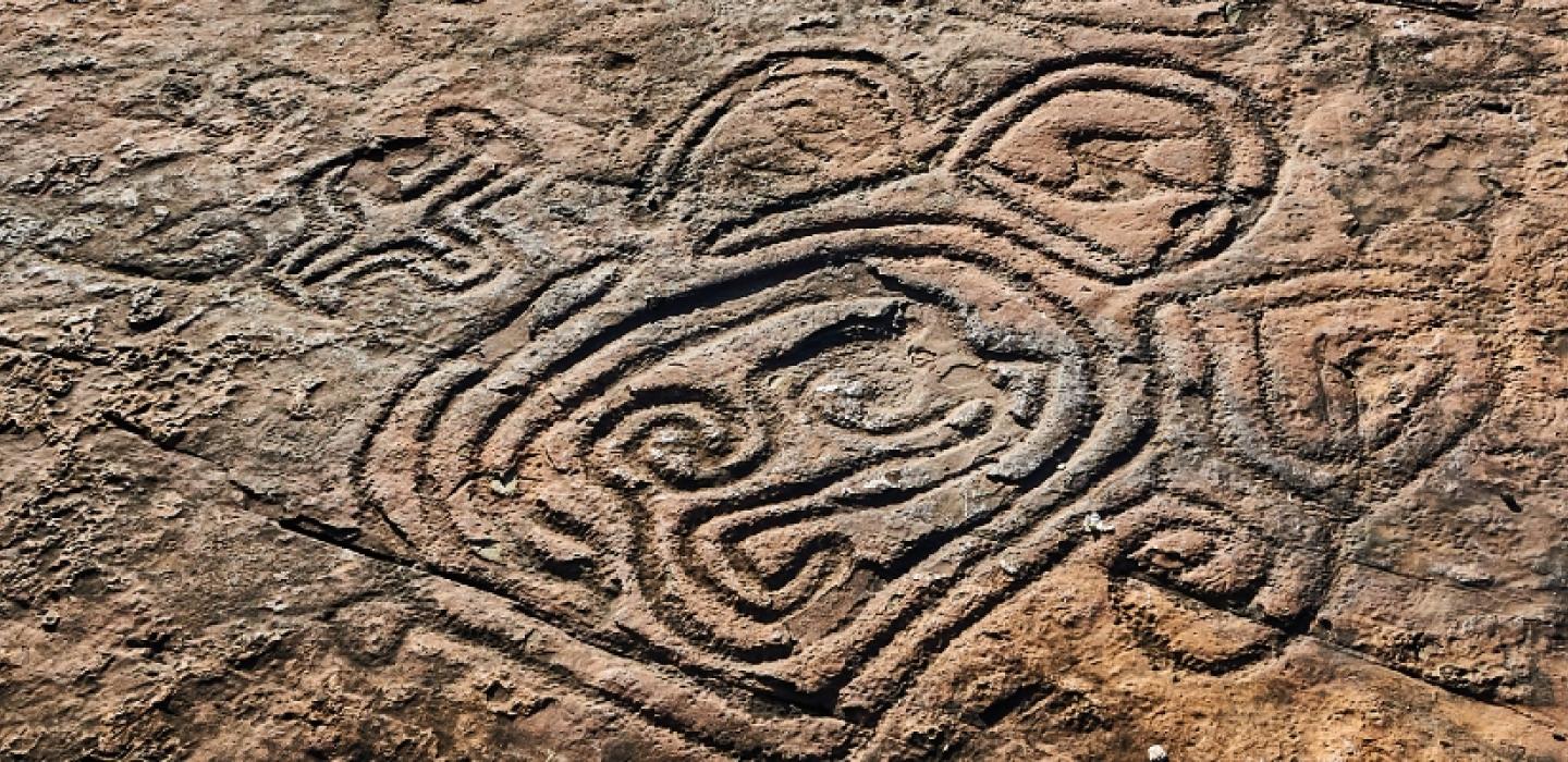 close up of design carved into rock