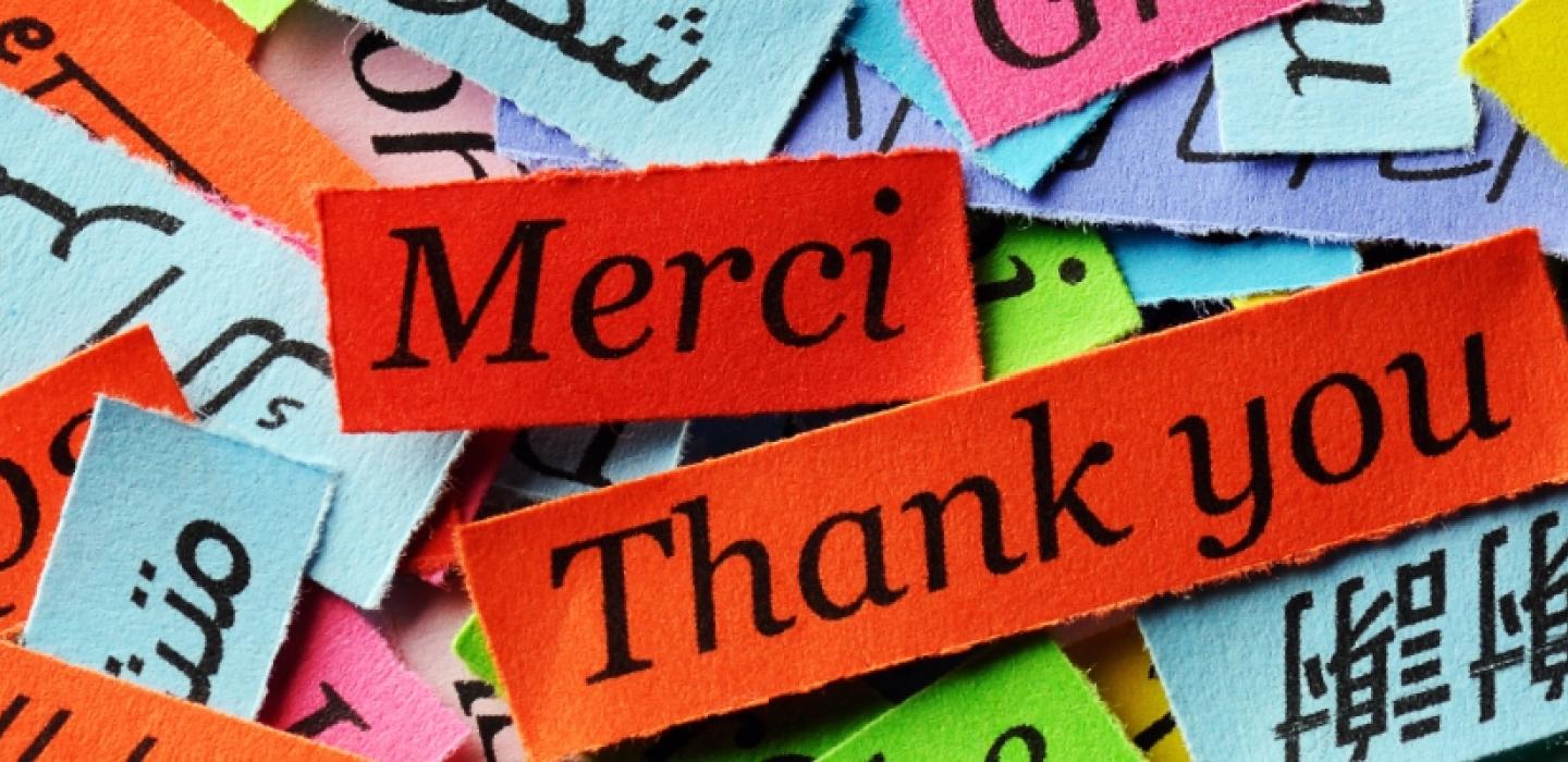 colored paper with the word "thank you" in many languages