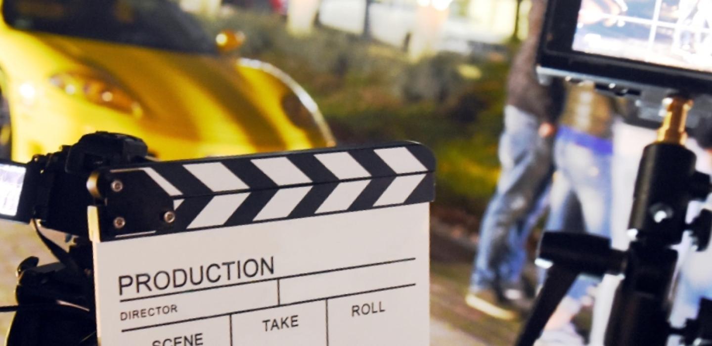 movie set with clapboard and video camera