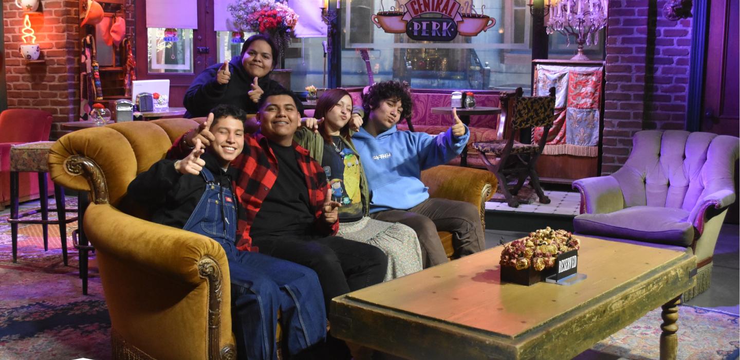 Photo of SSS students on the Friends couch at Warner Bros Studios