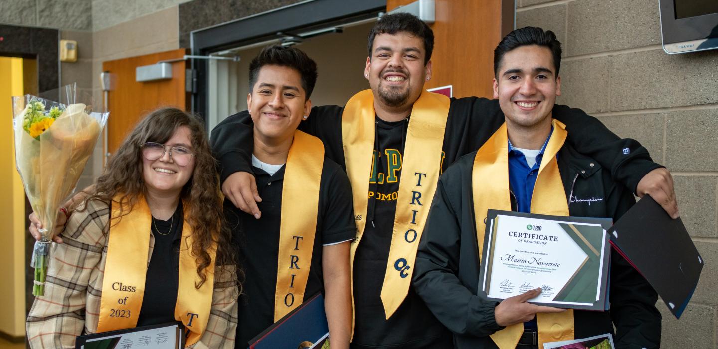 Four TRIO students at their graduation