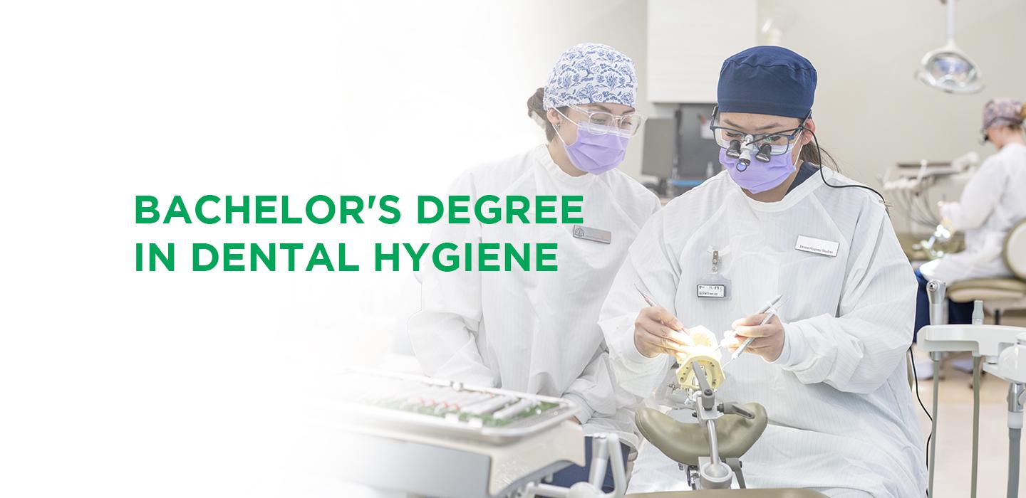 two dental students working with a mouth prosthetic