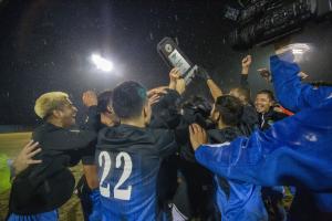 Soccer team celebrates their win